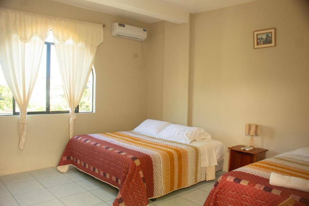 Postel nebo postele na pokoji v ubytování Casa de Nelly