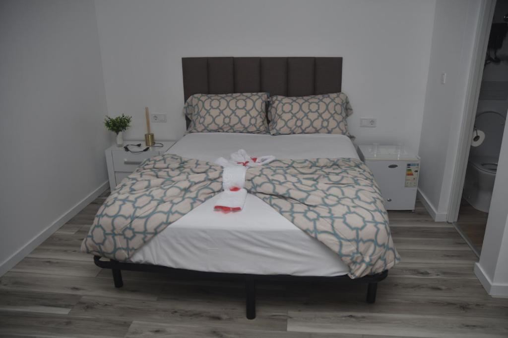 Postel nebo postele na pokoji v ubytování Hotel Cantinho