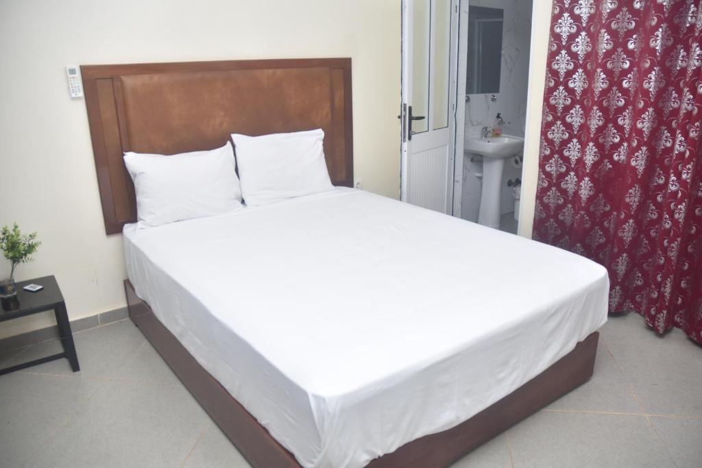 Postel nebo postele na pokoji v ubytování Hotel Cantinho