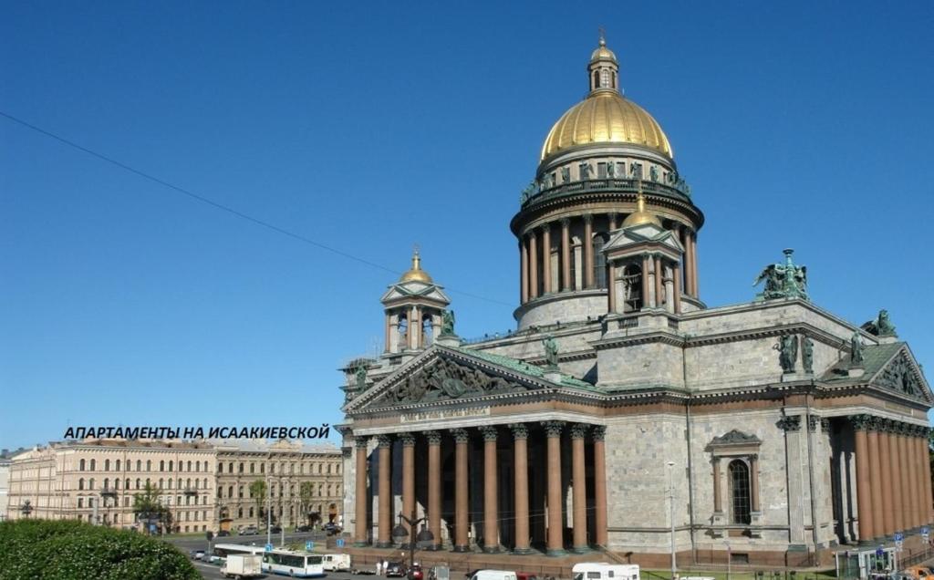 a large building with a gold dome on top of it at Apartments on Isaakievskaya in Saint Petersburg
