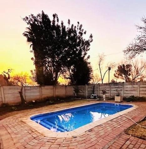 a small swimming pool in a brick yard at Kelello House House in Welkom