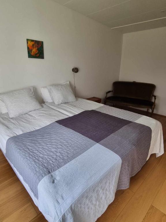 Postel nebo postele na pokoji v ubytování Spói Guesthouse