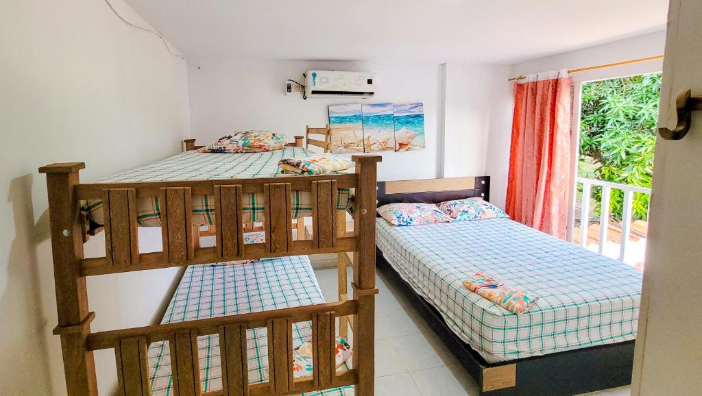 Postel nebo postele na pokoji v ubytování Casa Hotel Isabella
