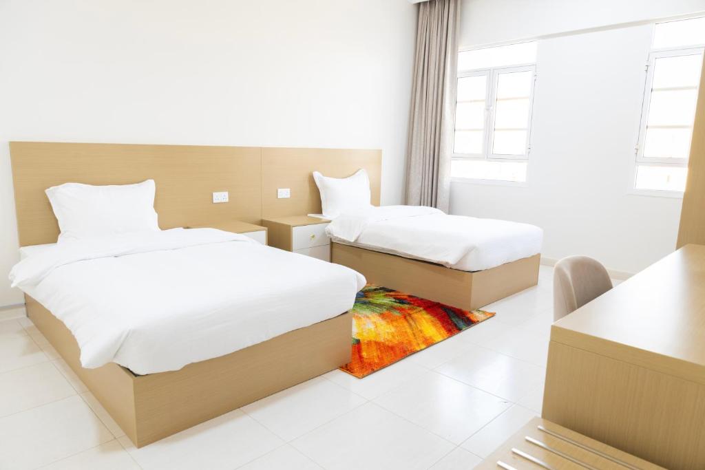 Postel nebo postele na pokoji v ubytování Riviera suites , hotel apartement