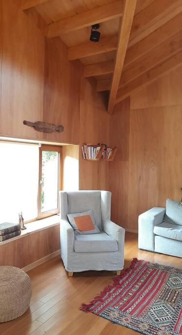 Posezení v ubytování Casa moderna en el bosque