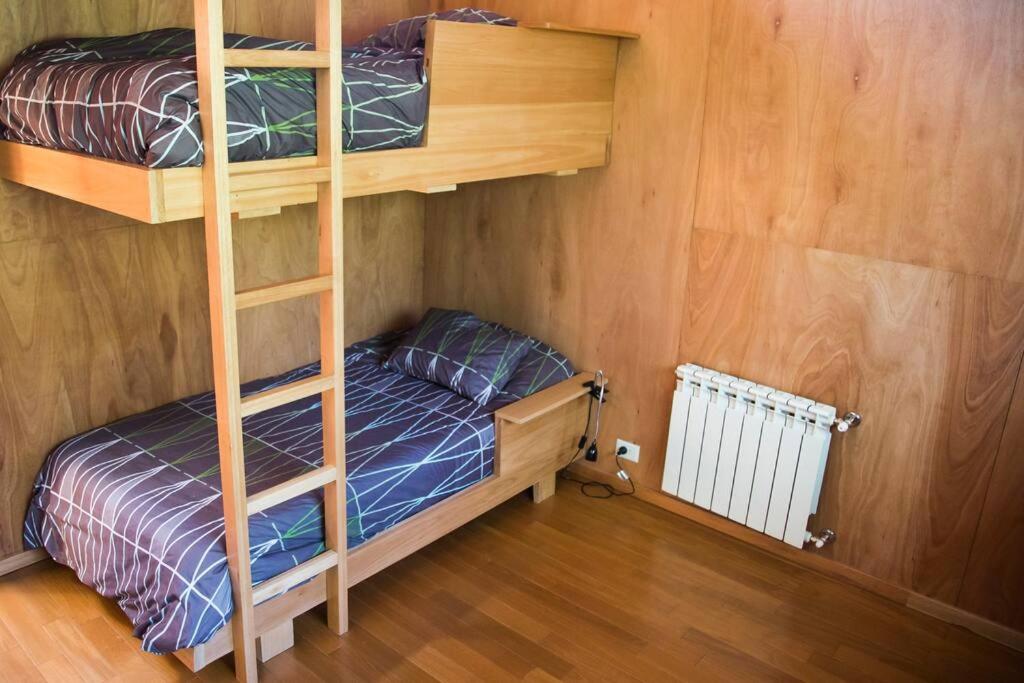 Postel nebo postele na pokoji v ubytování Casa moderna en el bosque