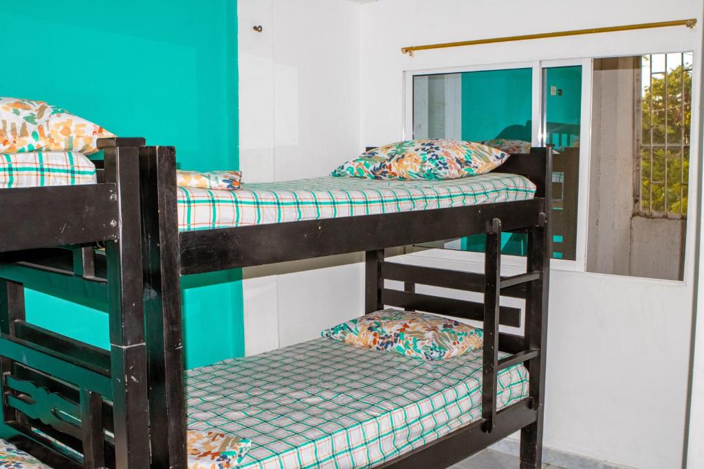 Postel nebo postele na pokoji v ubytování Casa Hotel Isabella