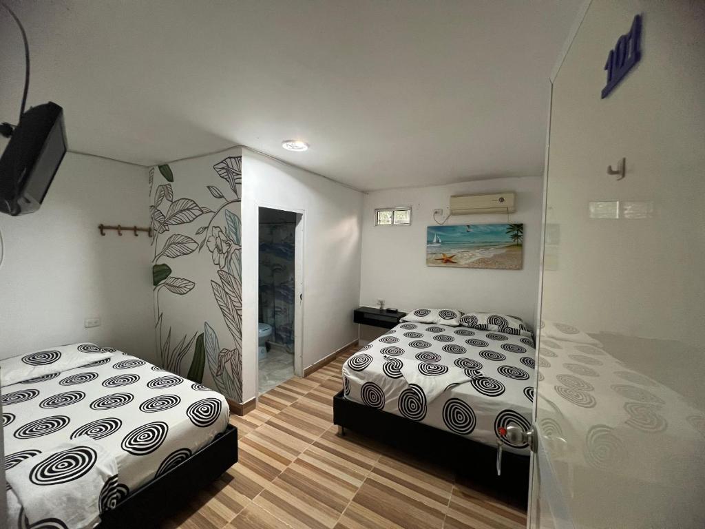 Postel nebo postele na pokoji v ubytování Casa Hotel Isabella