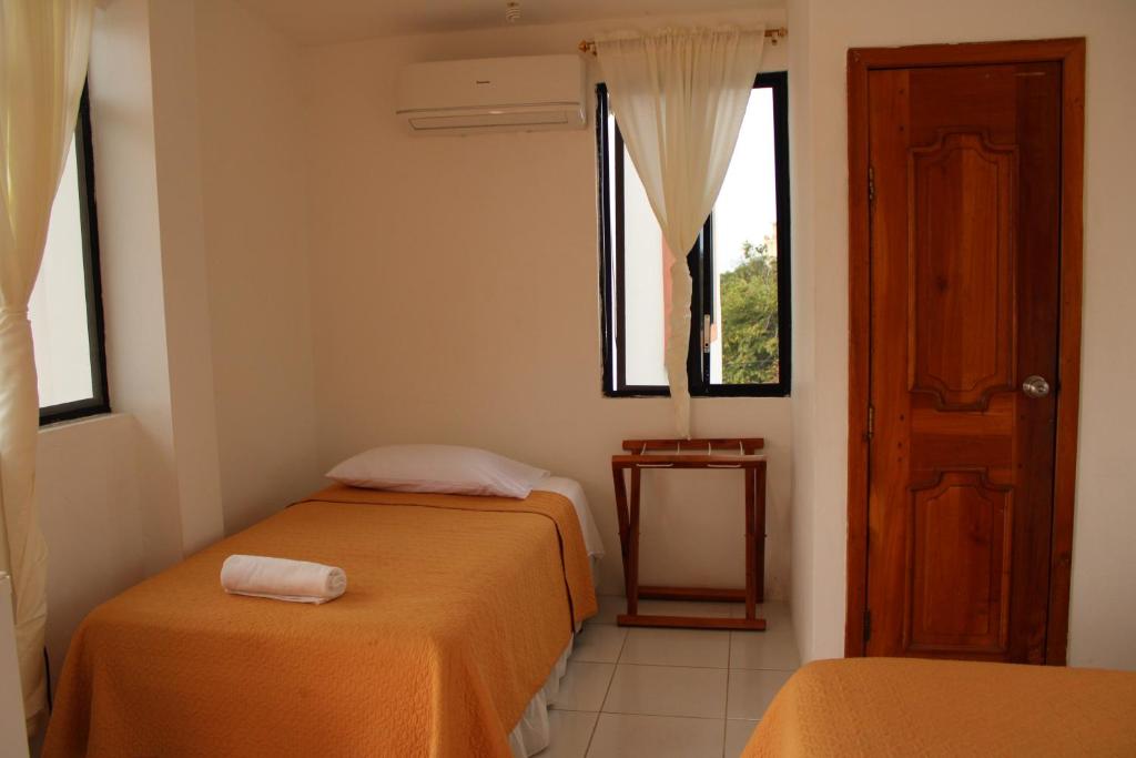 Postel nebo postele na pokoji v ubytování Casa de Nelly