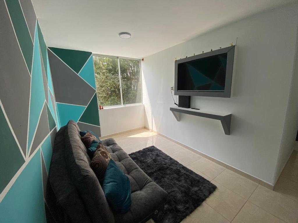 Μια τηλεόραση ή/και κέντρο ψυχαγωγίας στο Amplio apartamento 806