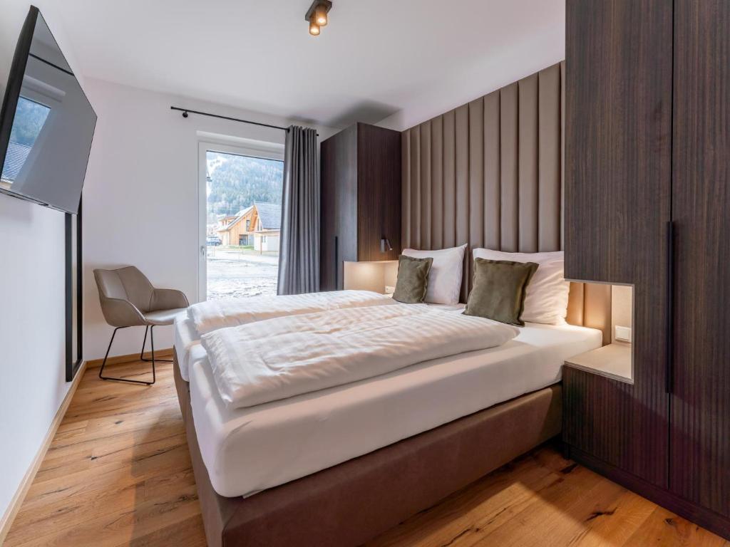 A bed or beds in a room at Mountain Chalet Arnica