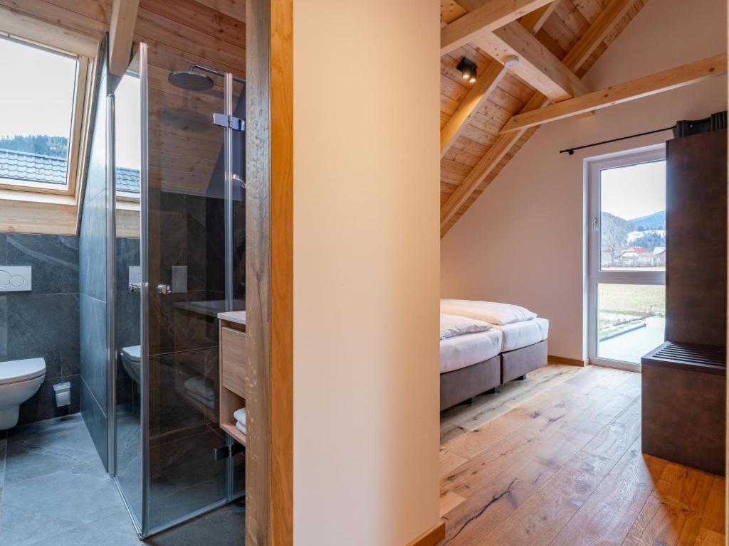 A bed or beds in a room at Mountain Chalet Arnica