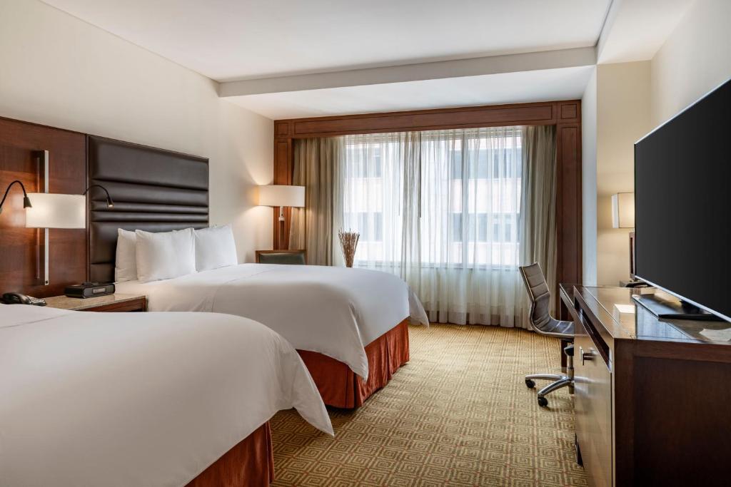 Postel nebo postele na pokoji v ubytování JW Marriott Hotel Bogotá
