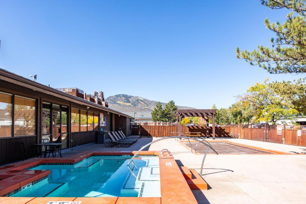 a swimming pool in the backyard of a house at Cozy stay for 4, 5 Min Drive to Base, Full Kitchen, Shared Hot Tub & Pool, Restaurants Nearby! in Park City