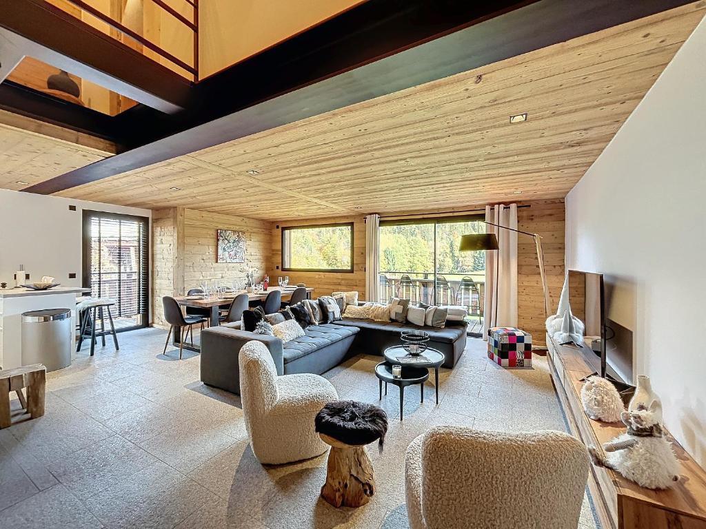 Posezení v ubytování Chalet de luxe avec vue Mont Blanc et parking - FR-1-560-150