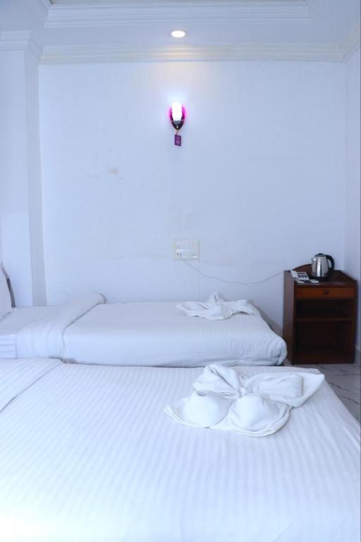 Voodi või voodid majutusasutuse Hotel Siddhartha in Lumbini toas