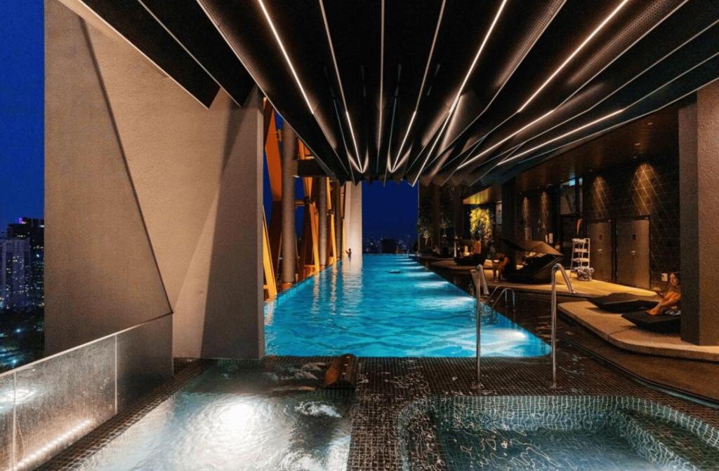 a swimming pool on the side of a building at Scarletz Suites KLCC in Kuala Lumpur
