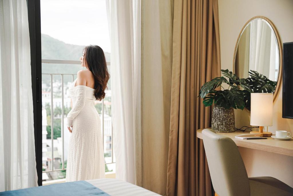 Giường trong phòng chung tại Elite Hotel Nha Trang