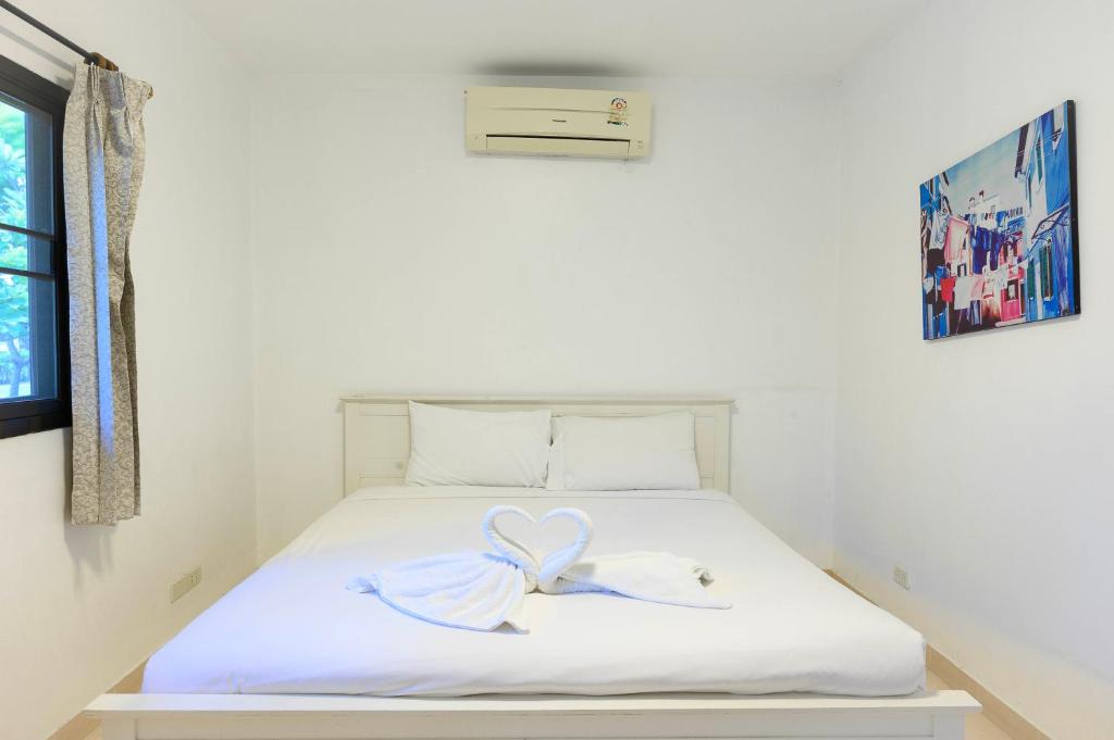 Postel nebo postele na pokoji v ubytování Two Fifty Nine Resort 259 Resort