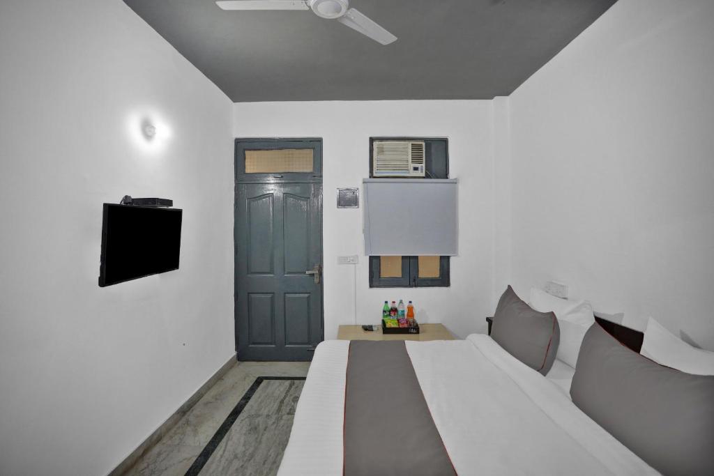 Postel nebo postele na pokoji v ubytování Hotel O The Premium Villa