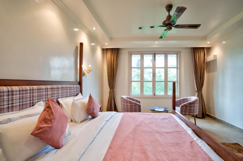 Postel nebo postele na pokoji v ubytování Hotel Sea Castle