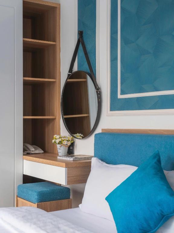 Postel nebo postele na pokoji v ubytování VMT Hotel Da Lat