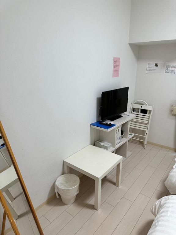 TV a/nebo společenská místnost v ubytování Residence天王寺東