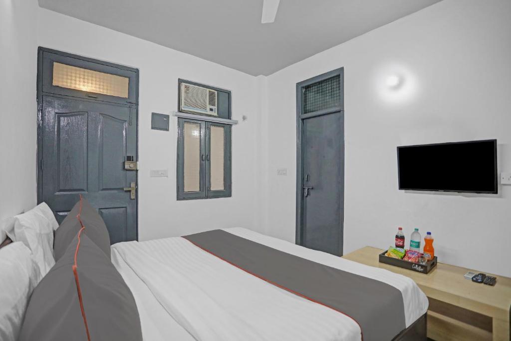 TV a/nebo společenská místnost v ubytování Hotel O The Premium Villa