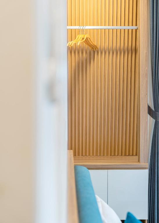 Postel nebo postele na pokoji v ubytování VMT Hotel Da Lat