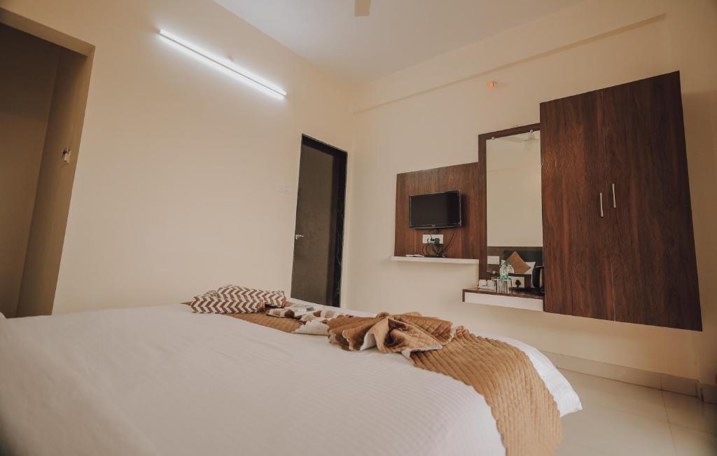 Postel nebo postele na pokoji v ubytování Hotel Mahabaleshwar Mount View