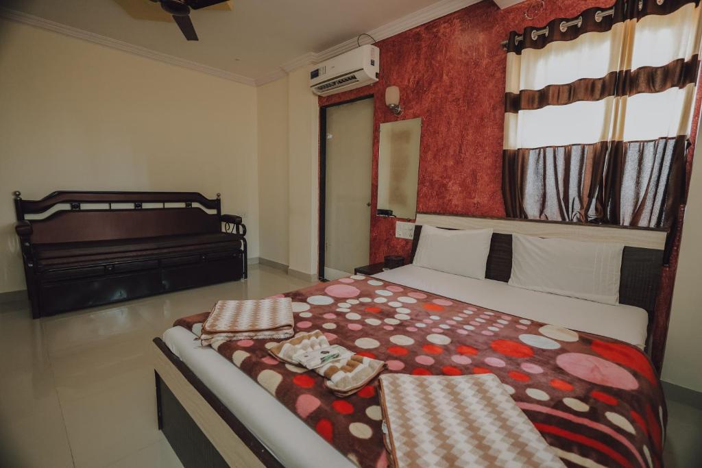 Postel nebo postele na pokoji v ubytování Hotel Mahabaleshwar Mount View