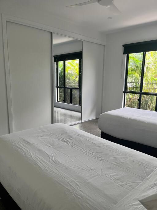 Postel nebo postele na pokoji v ubytování Eleven Watson Guesthouse