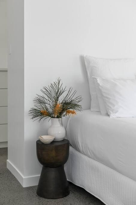 Postel nebo postele na pokoji v ubytování Eleven Watson Guesthouse
