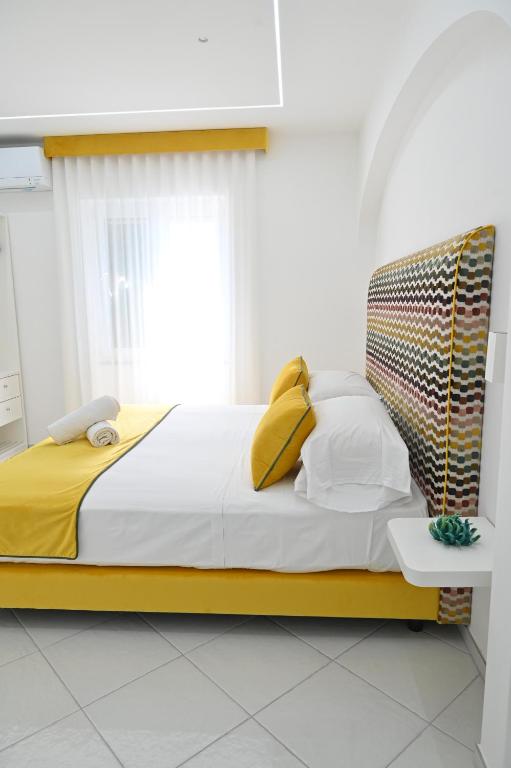 Postel nebo postele na pokoji v ubytování Gala Residence Villa Giovanna
