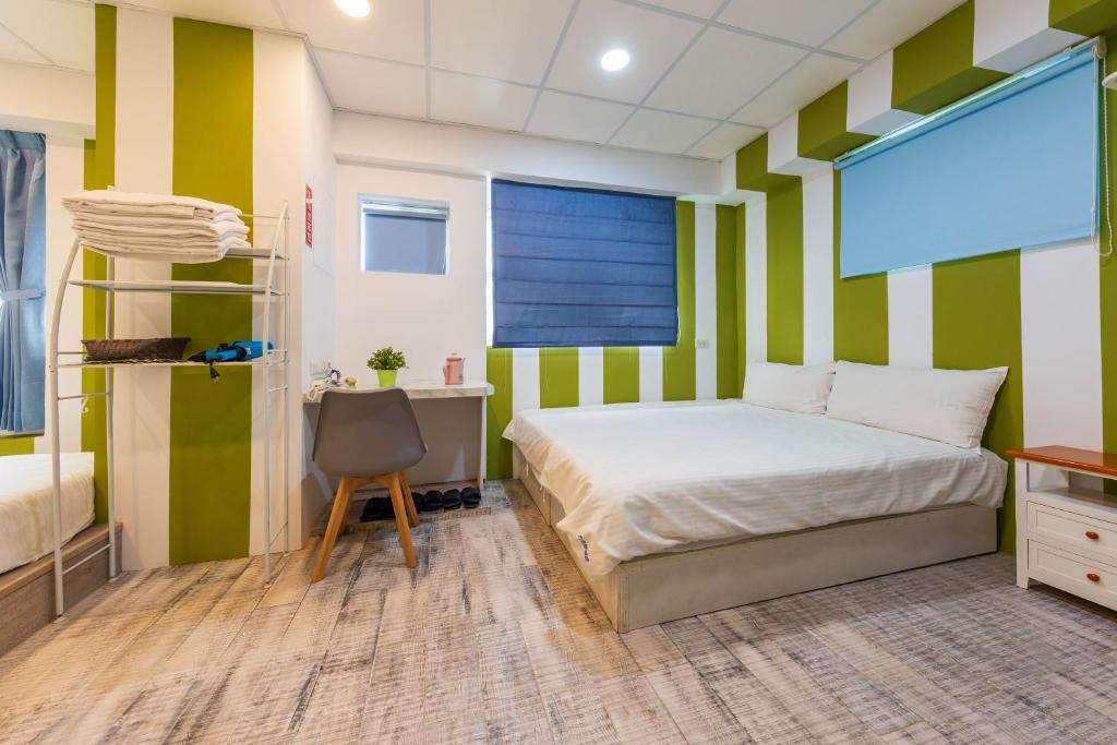 Postel nebo postele na pokoji v ubytování Liu He Su Hotel