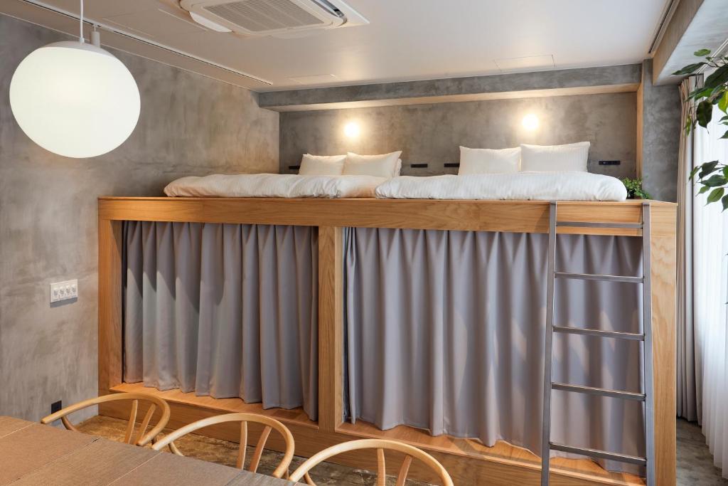 Postel nebo postele na pokoji v ubytování Hotel Ten Tamachi