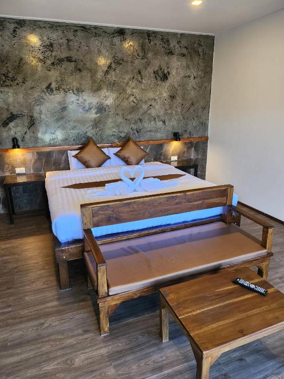 Postel nebo postele na pokoji v ubytování BuGaan Sukhothai Village