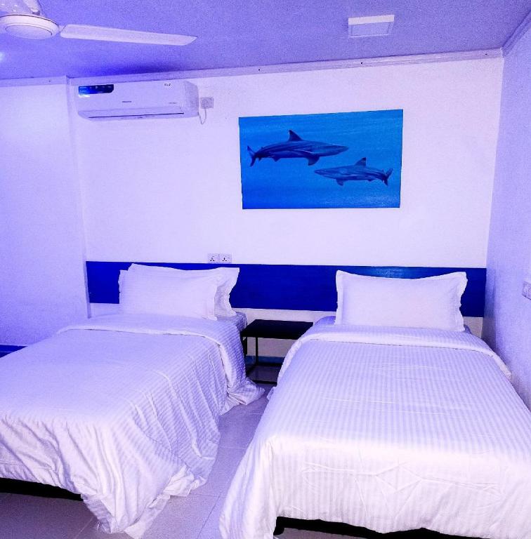 Postel nebo postele na pokoji v ubytování Kendhoo holidays