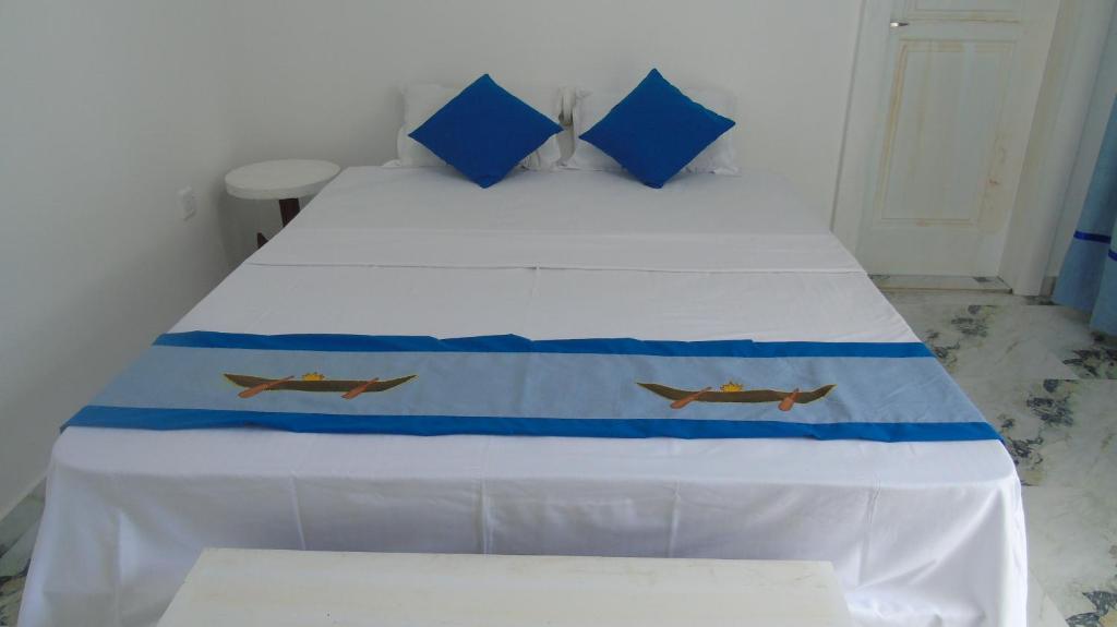 Postel nebo postele na pokoji v ubytování Ro Rich Hotel