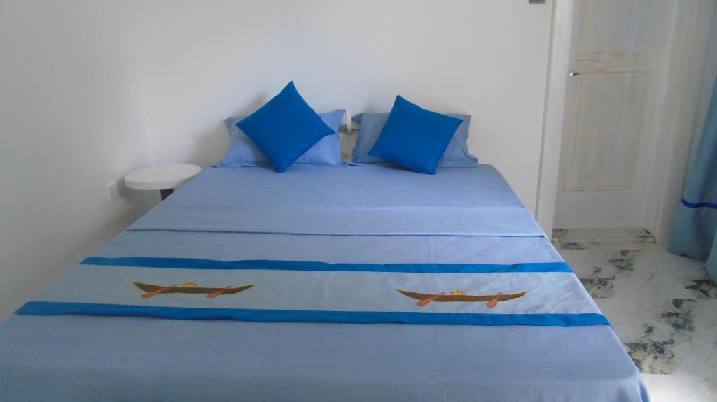Postel nebo postele na pokoji v ubytování Ro Rich Hotel