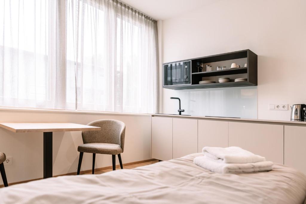 Postel nebo postele na pokoji v ubytování LOOMZ living Self-check-in