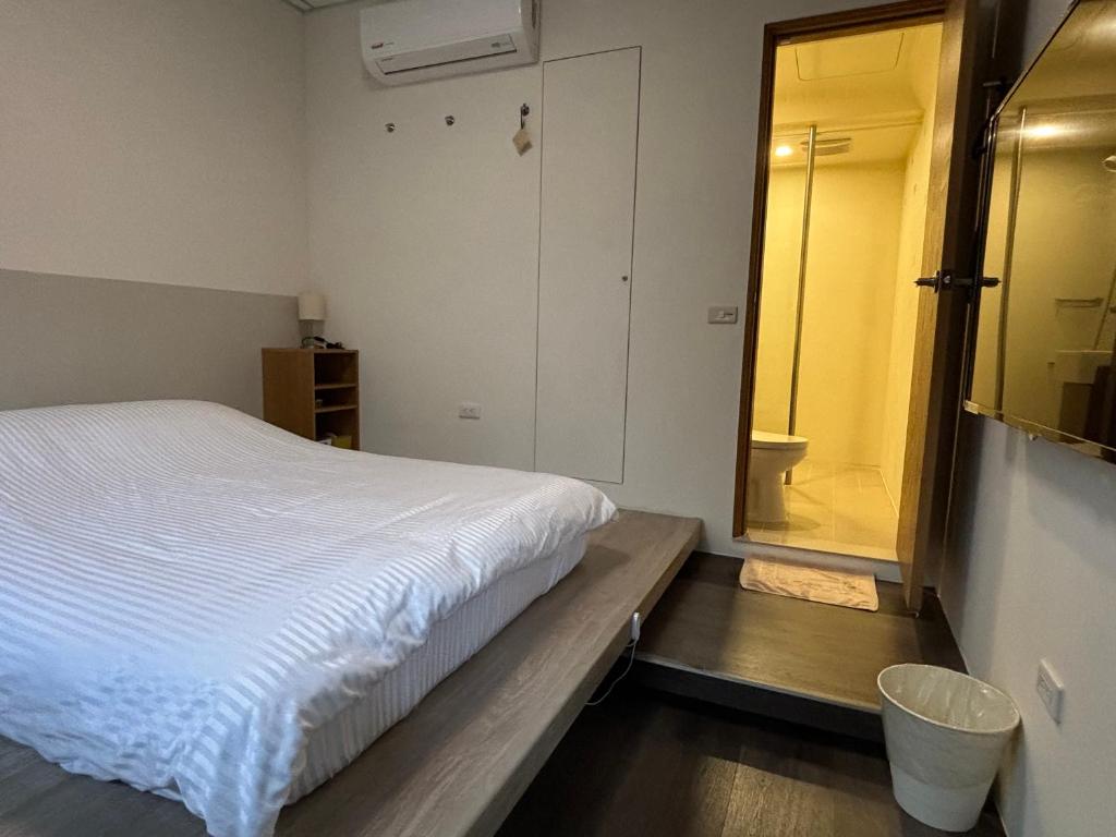 Postel nebo postele na pokoji v ubytování 幸福客棧