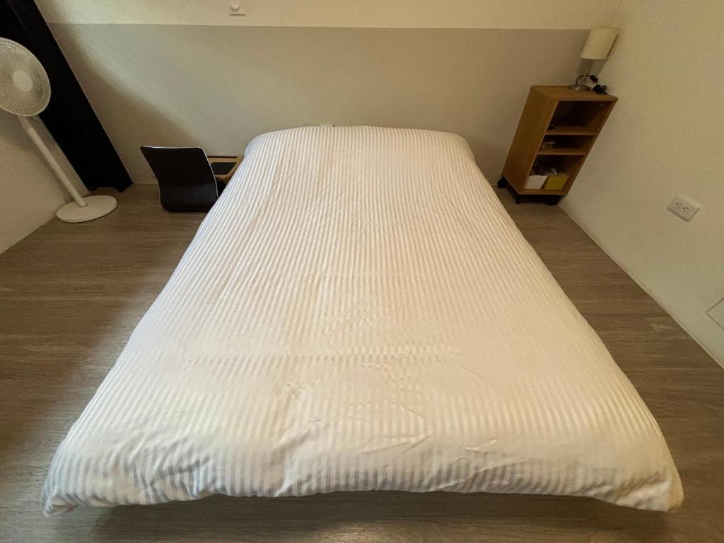 Postel nebo postele na pokoji v ubytování 幸福客棧