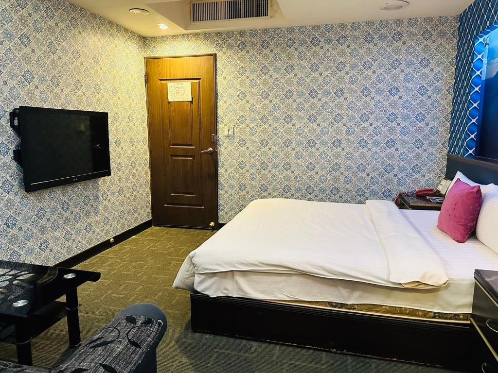TV a/nebo společenská místnost v ubytování Wecity Hotel 薇城精緻旅店