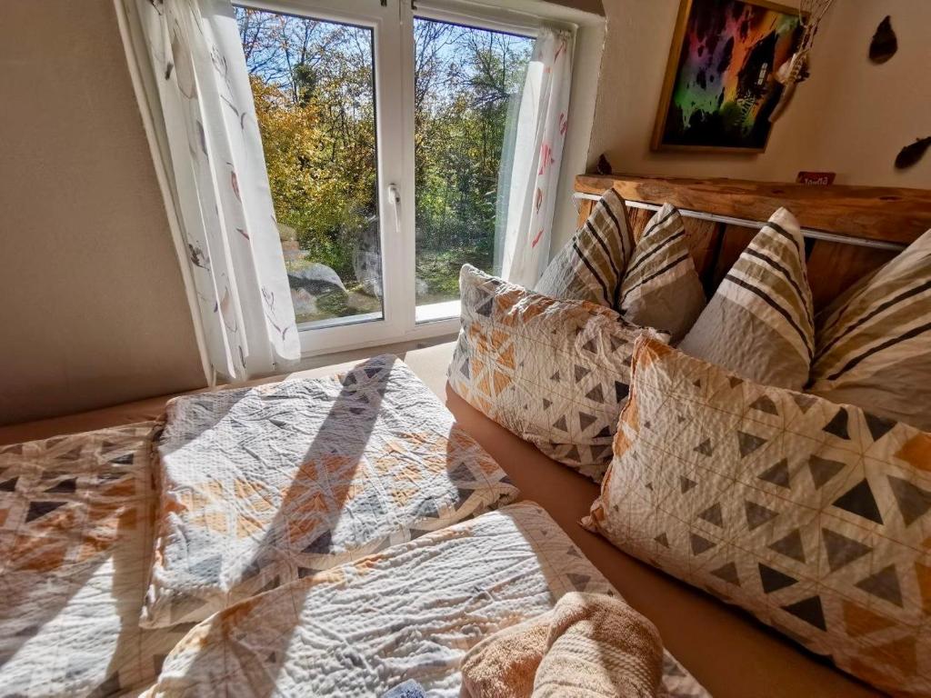 Postel nebo postele na pokoji v ubytování Little Dreamcatcher in Vadu Crisului Tomnatic Bihor Apuseni