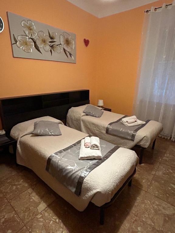 Postel nebo postele na pokoji v ubytování A casa di Lou