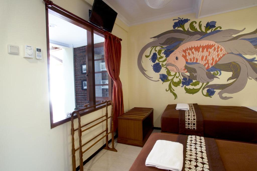 Posezení v ubytování De Hostel Yogyakarta