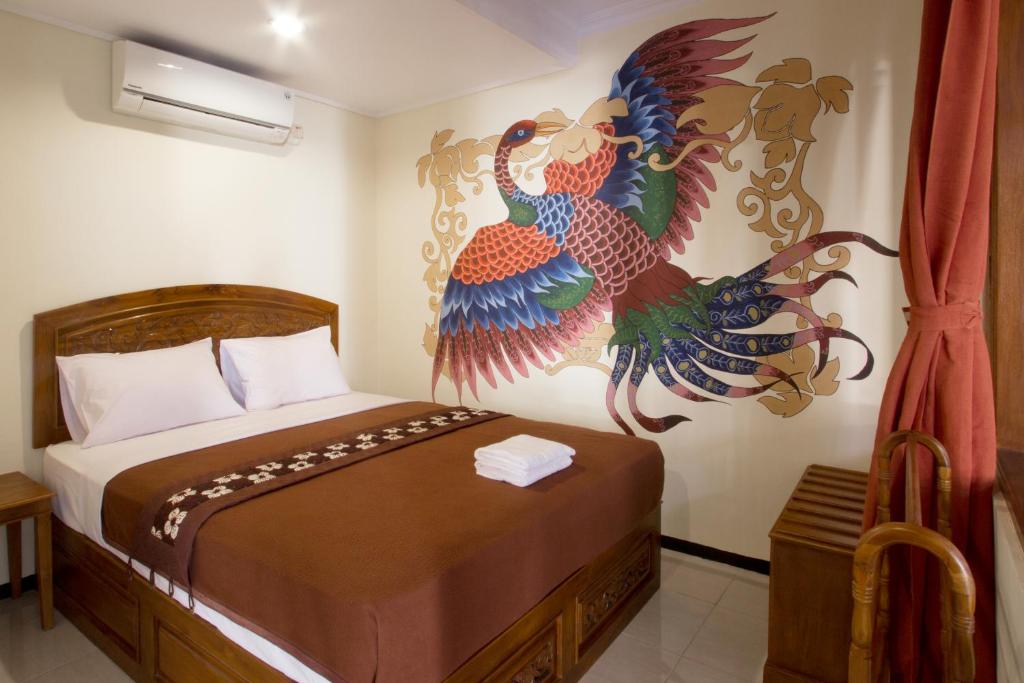 Postel nebo postele na pokoji v ubytování De Hostel Yogyakarta