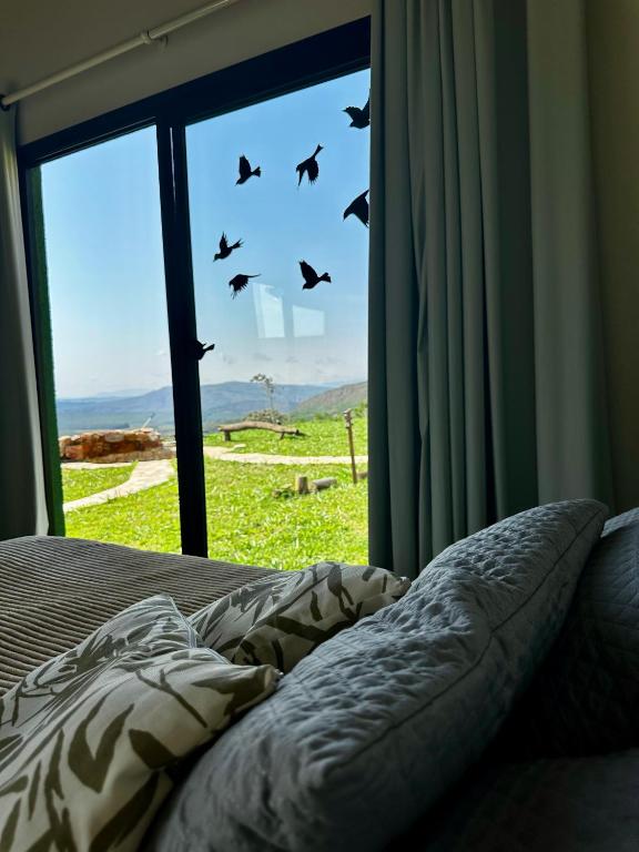 Postel nebo postele na pokoji v ubytování Canastra - Chalés Canário de Minas