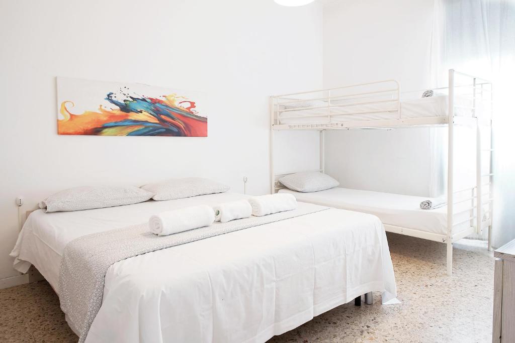 Posteľ alebo postele v izbe v ubytovaní Enjoy Apartment Gorla